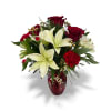 A ruby red and white Holiday arrangement that focuses on white asiatic