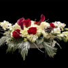 This unique winter seasonal arrangement arrives with an assortment of fresh flowers