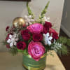 Beautiful sparkle pink roses with red roses, holiday greens and ornaments. It&#039;s