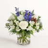 Inspired by winter&rsquo;s cool blue &amp; white landscape, our delightful arrangement delivers