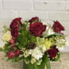 Christmas arrangement with hydrangea, roses, stock and other beautiful blooms in a
