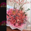 A beautiful bouquet of pink roses with flirty eucalyptus details that highlight