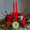 Bring holiday cheer to your table with this festive centerpiece featuring bright