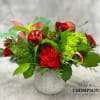 Spread some merry cheer with Jolly, a vibrant holiday arrangement bursting with