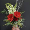 A blown polish candy cane vase filled with white birch branches, winter