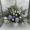 Traditional floor sympathy basket including hydrangea, roses, snapdragon, delphinium, stock and lizianthus.