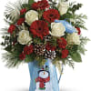 Red gerbera daisies, red miniature carnations, and white sinuata statice are accented
