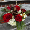 White hydrangea and red roses create a cutie arrangement, with gold accents
