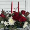 2 Candle centerpiece with red gerberas, red roses, white chrysanthemums, red berries