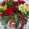 Green hydrangea, red roses, burgundy chrysanthemums, with Christmas greenery in a glazed