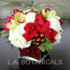 This festive bouquet features a traditional holiday palette of red, green and