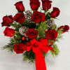 Santa baby really loves me 12 red roses arranged in a beautiful