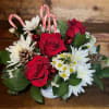 Red roses, white chrysanthemums, balsam and white with candy canes, pinecones, ornaments