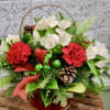 This shiny red basket is brimming with cheer! Fragrant Christmas greens, carnations