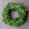Happy Holidays! Adorn your home with this lovely wreath featuring fresh greenery.