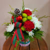 Festive holiday tin containing all of your Christmas cheer! The arrangement will
