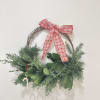 Wreath is available in one size. Decorated with Christmas greenery, ribbons, &amp;