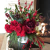 This design has Red France roses, tulips, peonies,berries,hydrangea,and amazing smelling Christmas greens!