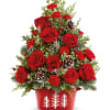 Bring holiday cheer home with Teleflora&#039;s Holiday Traditions Tree. This festive floral