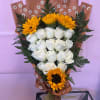 This gorgeous arrangement comes with 18 Roses and 4 Sunflowers. Absolutely stunning