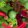 Holiday Designers Choice is an arrangement with holiday elements like bows,balls and
