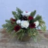 Roses, Carns and mums with ornament and pinecone accents come together to