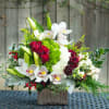 Vibrant red roses, white orchids, fragrant Lillies, subtle touches of dusty miller
