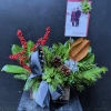 Holiday greens, ilex berries, ribbon, pine cone, baubles, succulent.