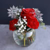 A sweet small arrangement exploding with style, glitter, and holiday decoration! Bring