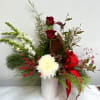 Metal can filled with seasonal favorites. Includes red roses, cinnamon sticks, genistra