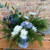 Such a charming arrangement, Holiday greens, eucalyptus, white mums, and carnations with