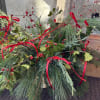 Our Holiday Wonder Centerpiece is a festive celebration of winter greens- full