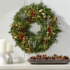 Greet the holiday season with a festive wreath. A base of live