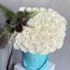 A luxurious winter statement, featuring 50 premium Playa Blanca white roses arranged