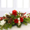A timeless classic Christmas centerpiece featuring a holiday pillar candle, scented woodland