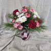 This festive holiday arrangement captures the sweetness and charm of the season.