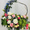 Send this beautifully designed arrangement of roses, eryngium, carnations, spider chrysanthemum, delphinium