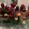 A festive, long and low arrangement, perfect for any holiday table.