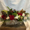 A traditional arrangement perfect for your Christmas gathering. A low and lush
