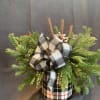 Buffalo check vase filled with mixed ever greens, pine cones, berries and