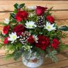 This jolly arrangement has fresh flowers such as roses, carnations and pomps