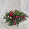 Bring classic holiday charm to your home with this festive Christmas centerpiece.