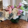 White hydrangea, pink lilies, pale pink and lavender roses, green spider chrysanthemums