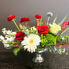 Red and White blooms are accented in a mercery glass bowl to