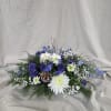 Bring frosty holiday charm with this blue and white centerpiece, accented with
