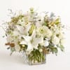 NEW As white and glimmering as freshly fallen snow, this arrangement captures