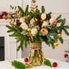 Illuminate your holiday season with this sophisticated vase arrangement that blends natural