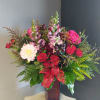 A beautifully selected bunch of the freshest flowers in a vase uniquely