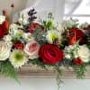 This Holiday centerpiece is the symphony of Holiday joy! Filled with fresh