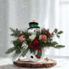 Celebrate the season with our charming Snowman Christmas Arrangement, a festive holiday